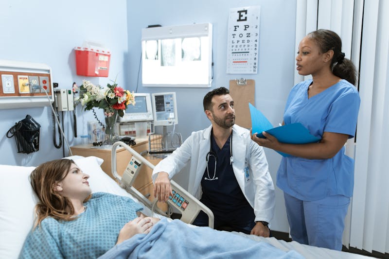 Doctor consulting with elderly patient about Alzheimer's screening