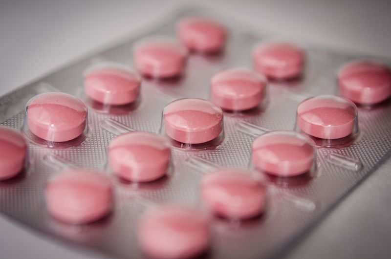 Medication pills representing artemisinin-based combination therapy