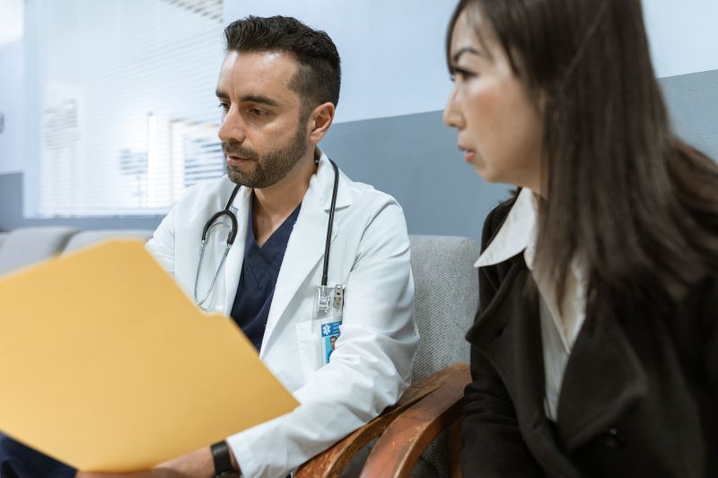 Doctor consulting with patient about malaria treatment