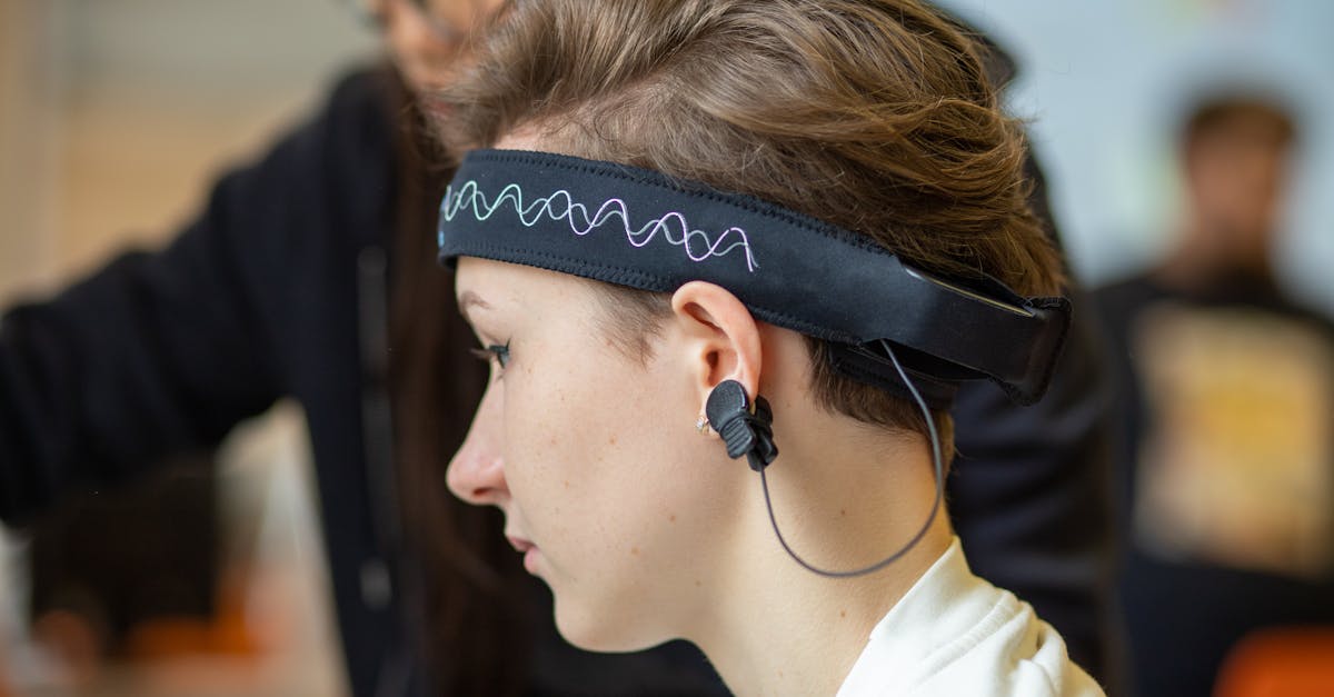 Healthcare professional conducting an EEG brain examination using advanced neurological monitoring equipment