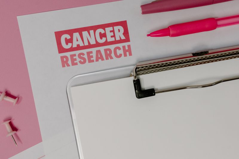 Cancer research paper representing groundbreaking CAR-T therapy research