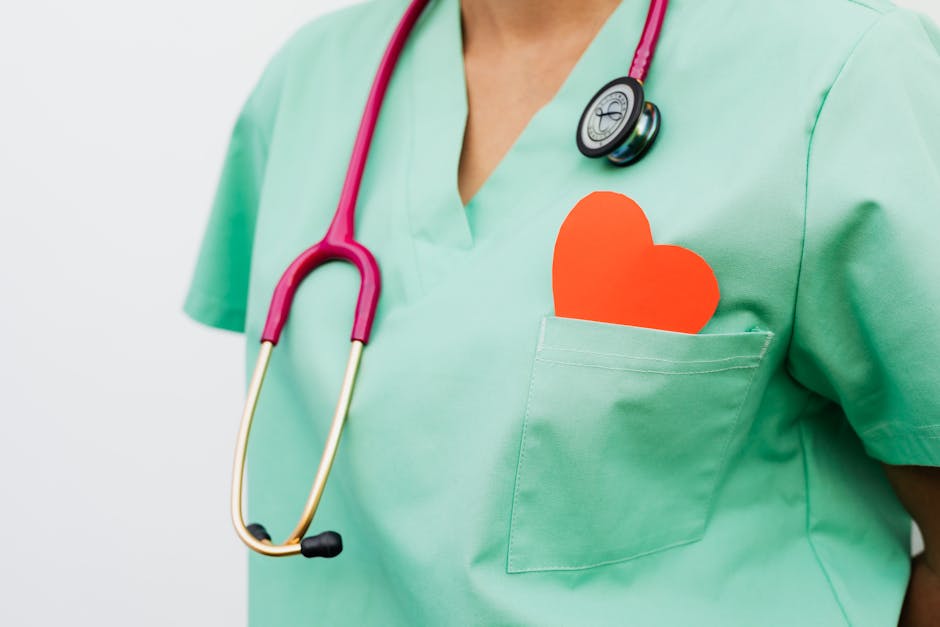 A healthcare professional with a stethoscope and a red heart symbol representing cardiology care