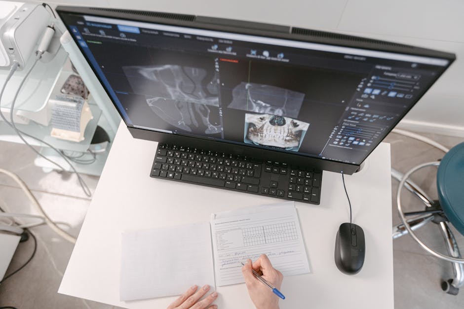 Radiologist analyzing medical scans on computer monitors