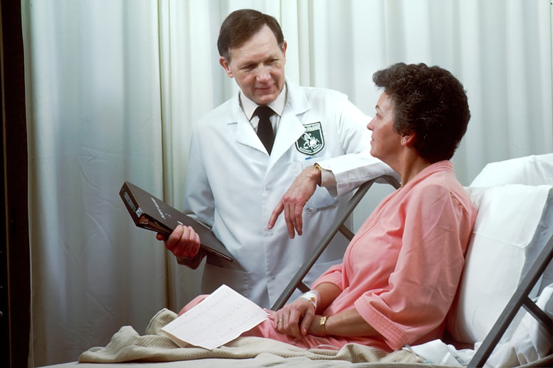 Doctor consulting with elderly patient