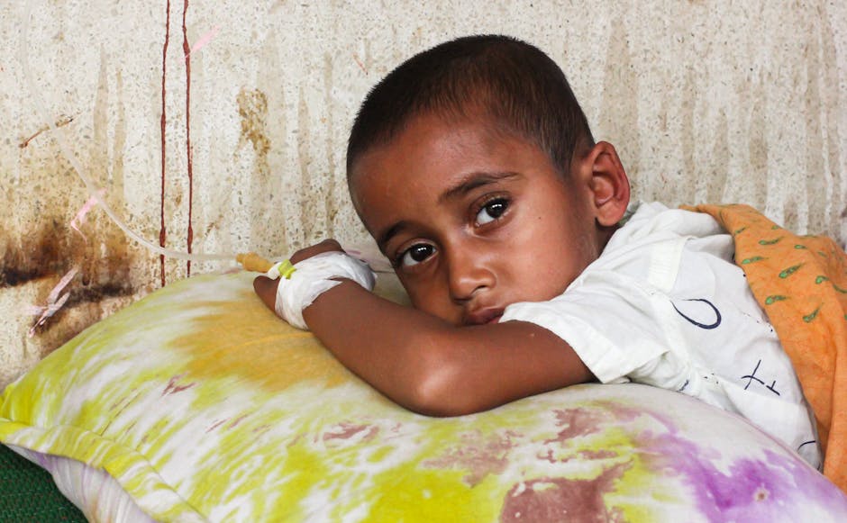 Young child receiving medical care in hospital setting