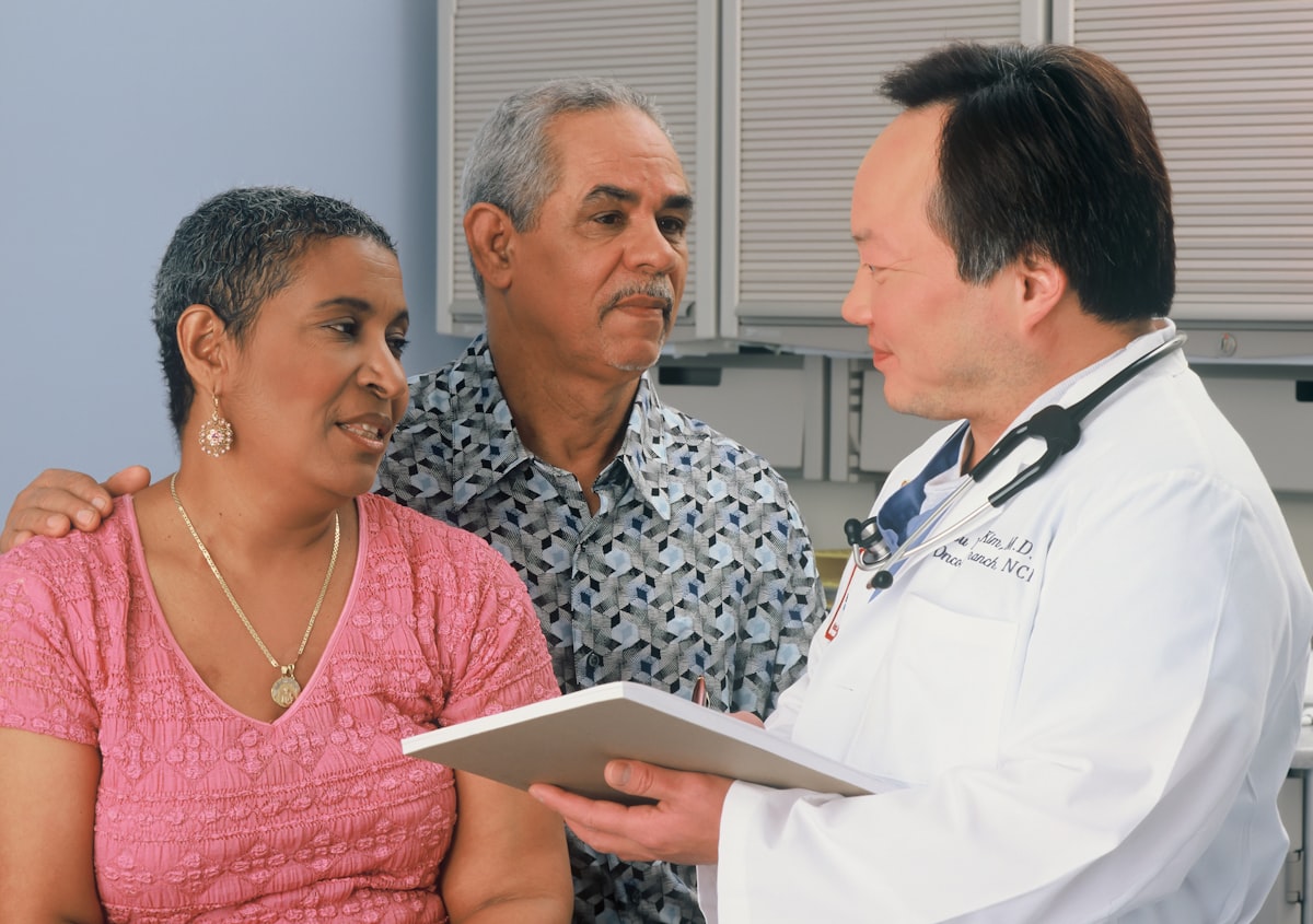 Medical consultation between doctor and patient discussing treatment