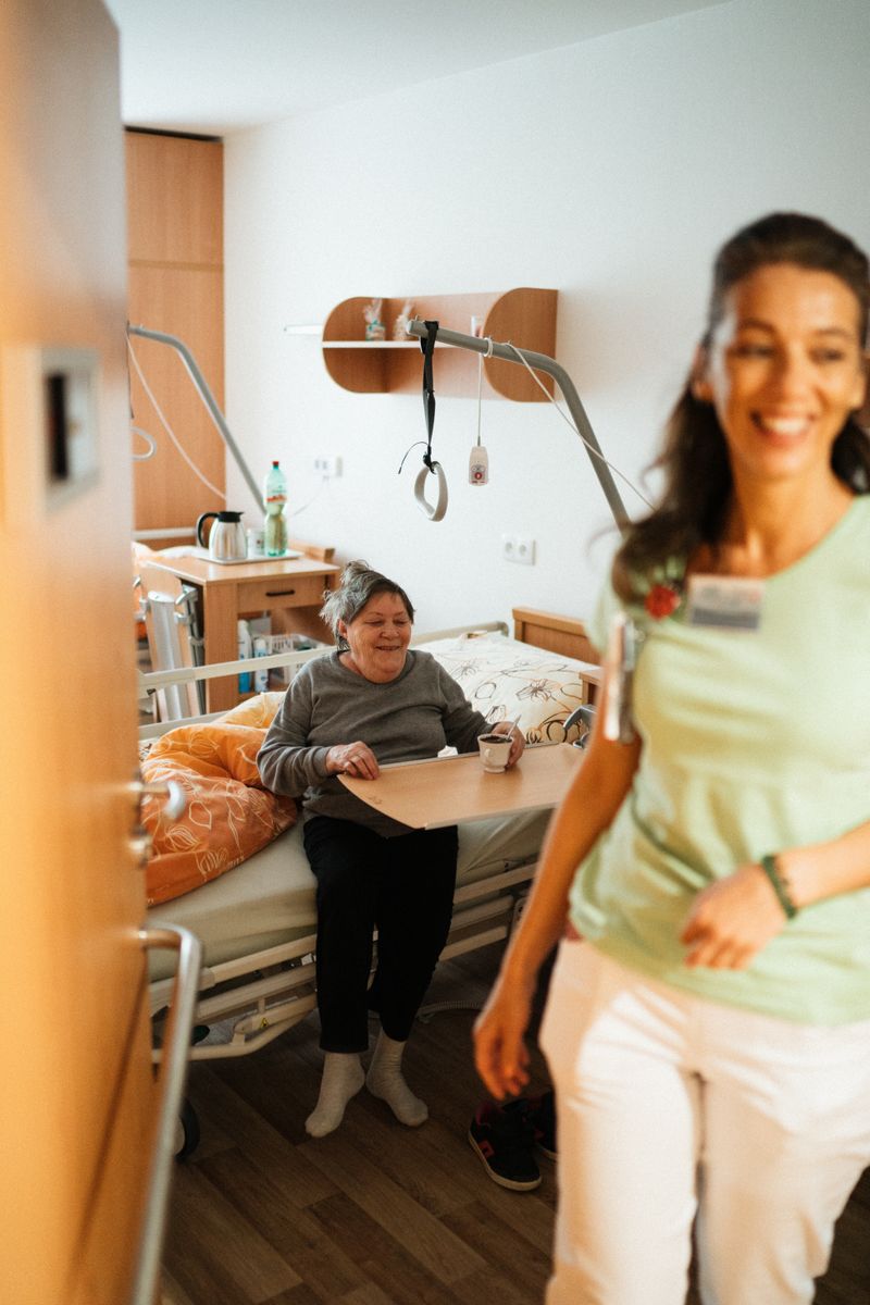 Nurse providing compassionate care to elderly patient
